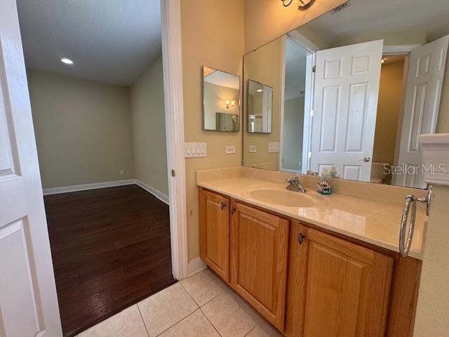 1442 Stickley Avenue Celebration, FL 34747 - Photo 24 of 46 a bathroom with a sink and a mirror