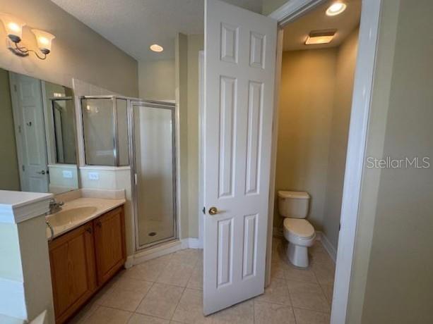 1442 Stickley Avenue Celebration, FL 34747 - Photo 25 of 46 a bathroom with a granite countertop sink toilet and shower