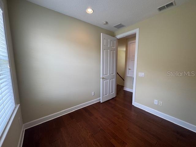 1442 Stickley Avenue Celebration, FL 34747 - Photo 27 of 46 an empty room with wooden floor and entrance