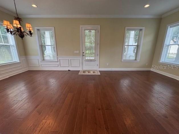 1442 Stickley Avenue Celebration, FL 34747 - Photo 3 of 46 a view of an empty room with wooden floor and a window