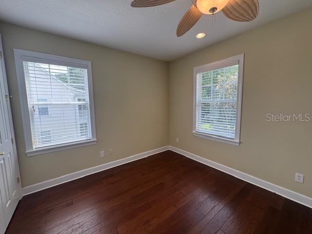 1442 Stickley Avenue Celebration, FL 34747 - Photo 33 of 46 a view of an empty room with wooden floor and a window