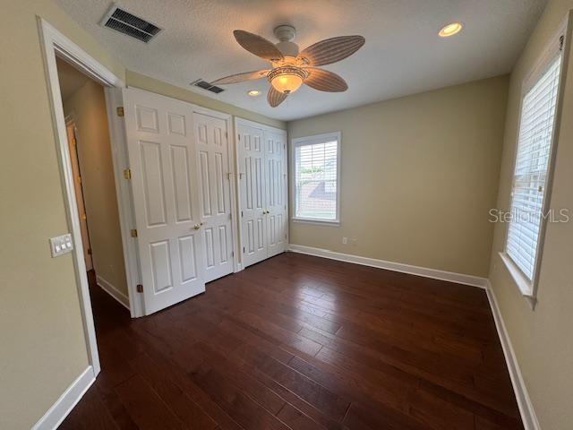 1442 Stickley Avenue Celebration, FL 34747 - Photo 34 of 46 an empty room with wooden floor and windows