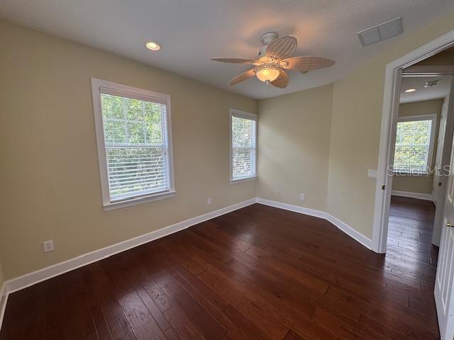 1442 Stickley Avenue Celebration, FL 34747 - Photo 35 of 46 a view of an empty room with wooden floor and a window
