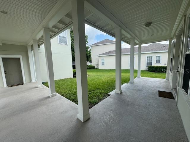 1442 Stickley Avenue Celebration, FL 34747 - Photo 40 of 46 a view of a house with backyard and porch