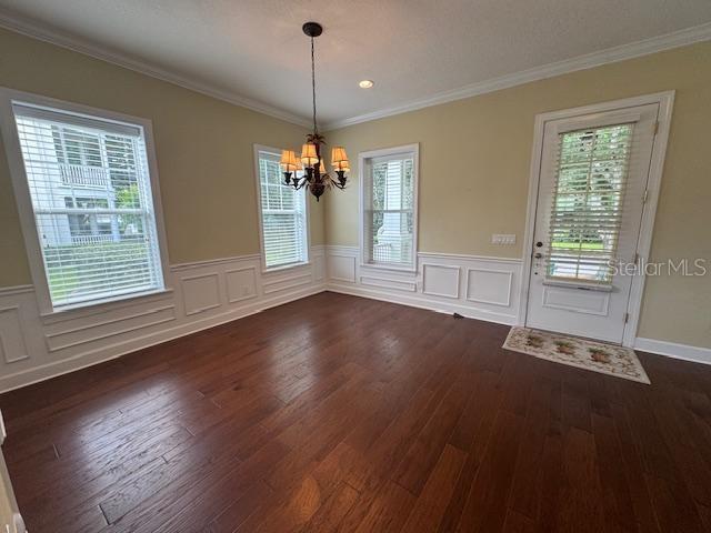 1442 Stickley Avenue Celebration, FL 34747 - Photo 5 of 46 a view of an empty room with wooden floor fridge and a window