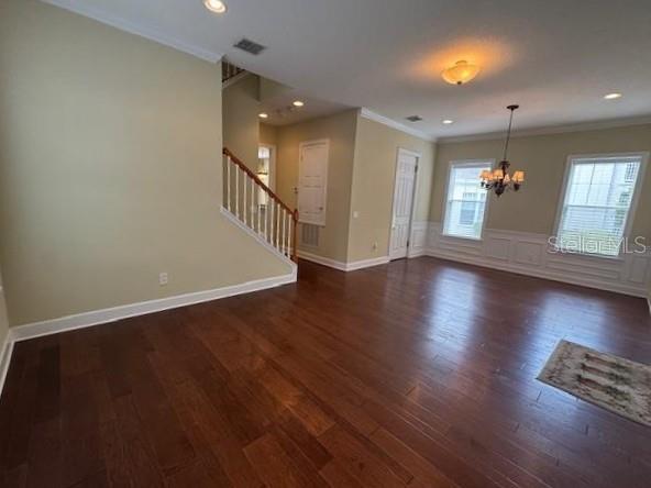 1442 Stickley Avenue Celebration, FL 34747 - Photo 8 of 46 an empty room with wooden floor and windows