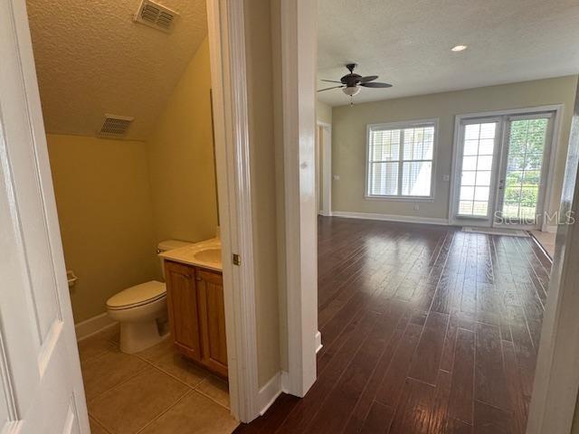 1442 Stickley Avenue Celebration, FL 34747 - Photo 9 of 46 a bathroom with a toilet sink and a mirror