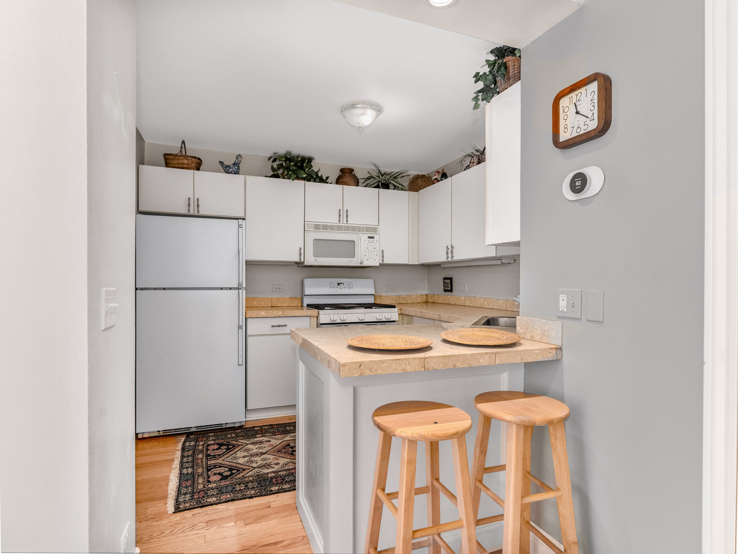 471 River Bend Road, Unit 107 Naperville, IL 60540 - Photo 13 of 31 a kitchen with a white stove top oven and refrigerator