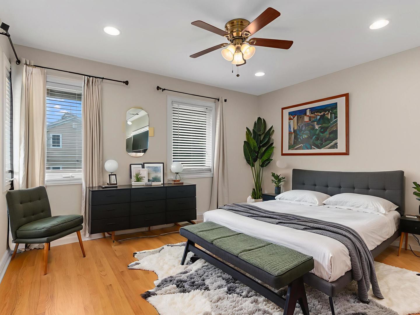 471 River Bend Road, Unit 107 Naperville, IL 60540 - Photo 15 of 31 a bedroom with a bed a chair and a large mirror with a workspace