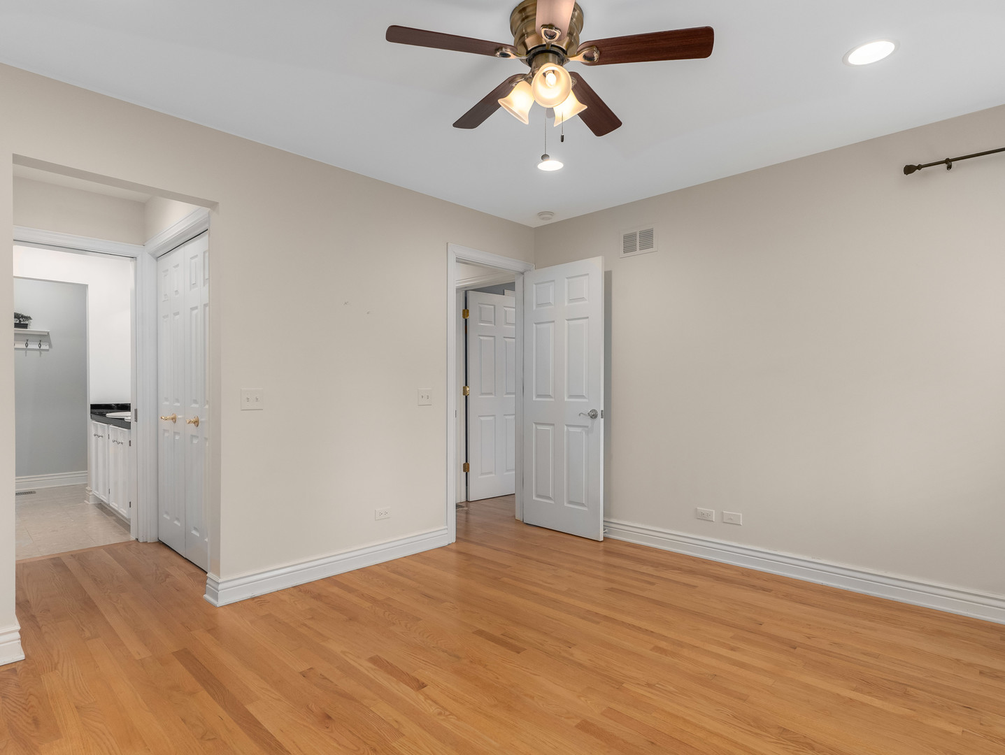 471 River Bend Road, Unit 107 Naperville, IL 60540 - Photo 17 of 31 wooden floor in an empty room with a window