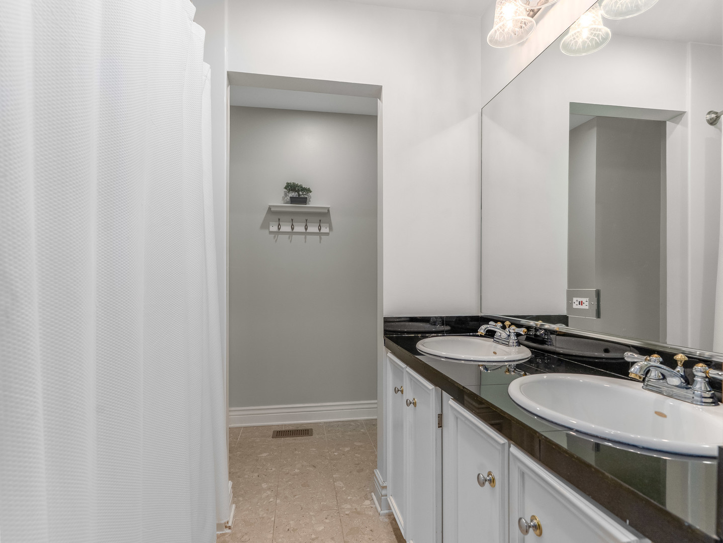 471 River Bend Road, Unit 107 Naperville, IL 60540 - Photo 18 of 31 a bathroom with a sink and a mirror