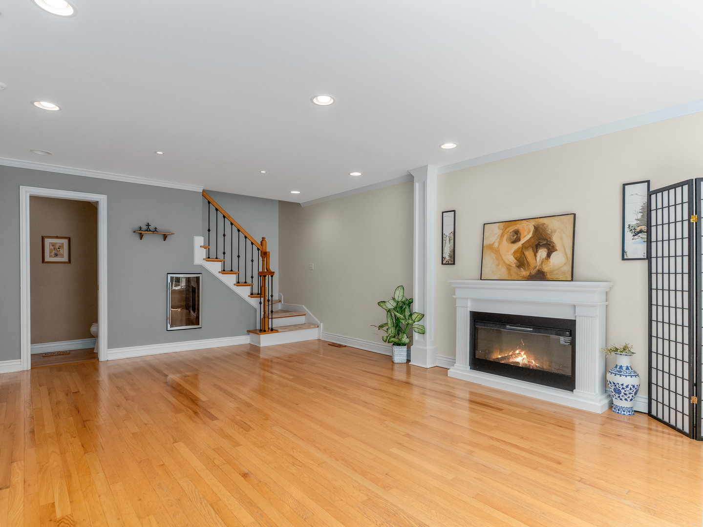 471 River Bend Road, Unit 107 Naperville, IL 60540 - Photo 6 of 31 a living room with furniture and a fireplace