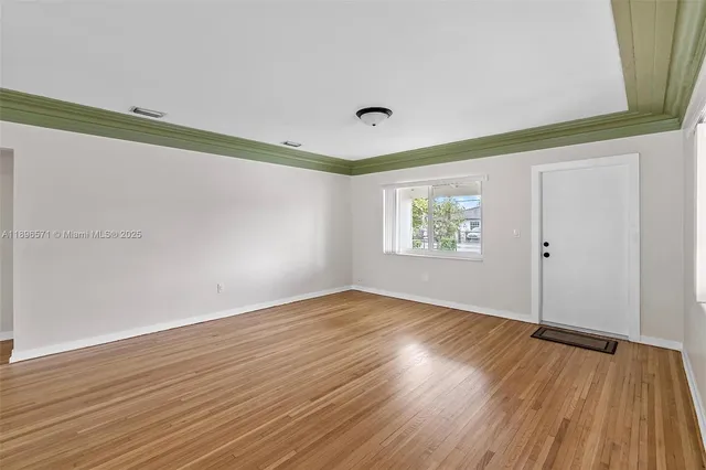 a view of an empty room and window