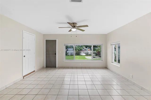 a view of an empty room with a window