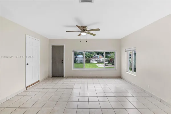 a view of an empty room with a window