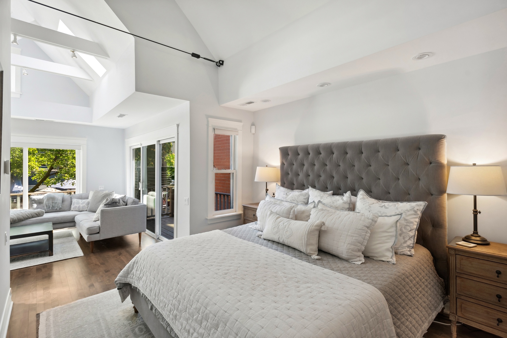 2511 North Burling Street Chicago, IL 60614 - Photo 16 of 37 a large bedroom with bed couches and large windows