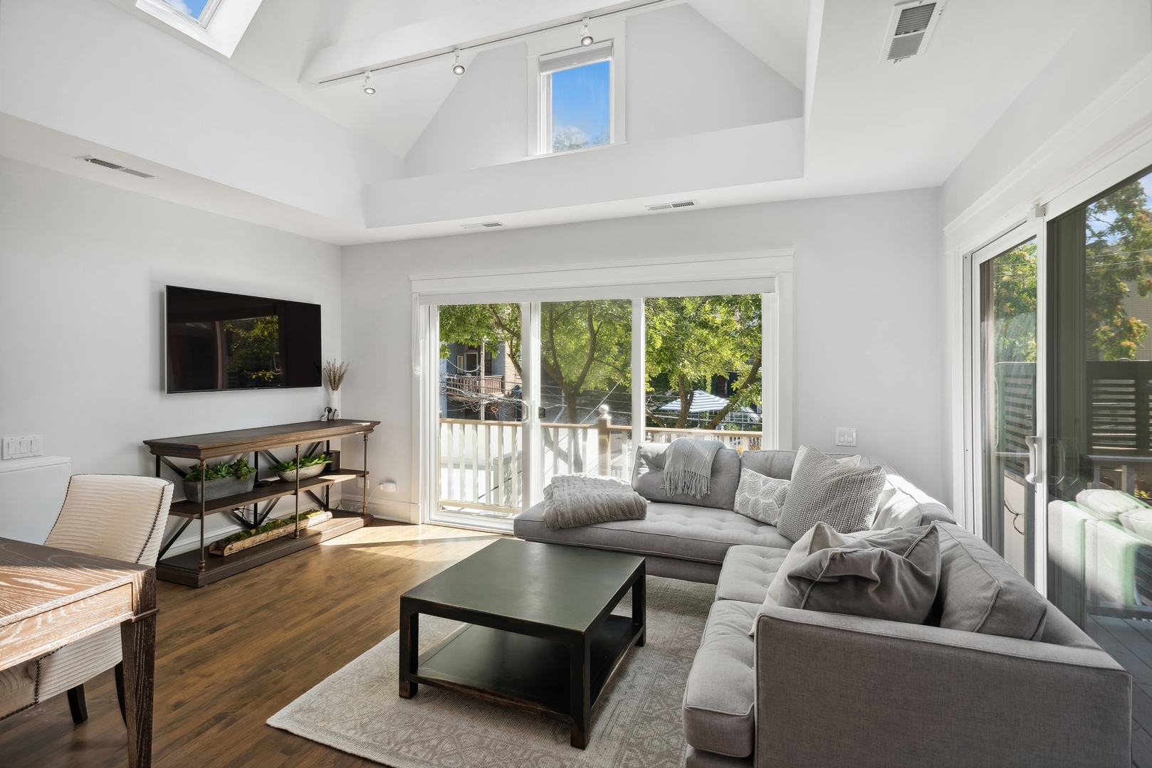 2511 North Burling Street Chicago, IL 60614 - Photo 18 of 37 a living room with furniture and a flat screen tv