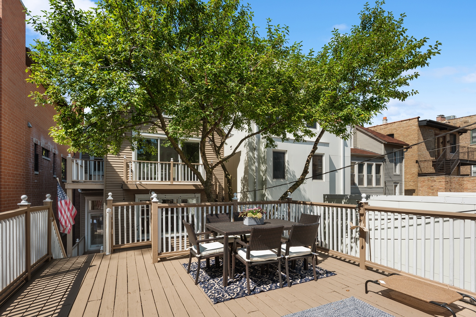 2511 North Burling Street Chicago, IL 60614 - Photo 30 of 37 a view of a house with wooden deck