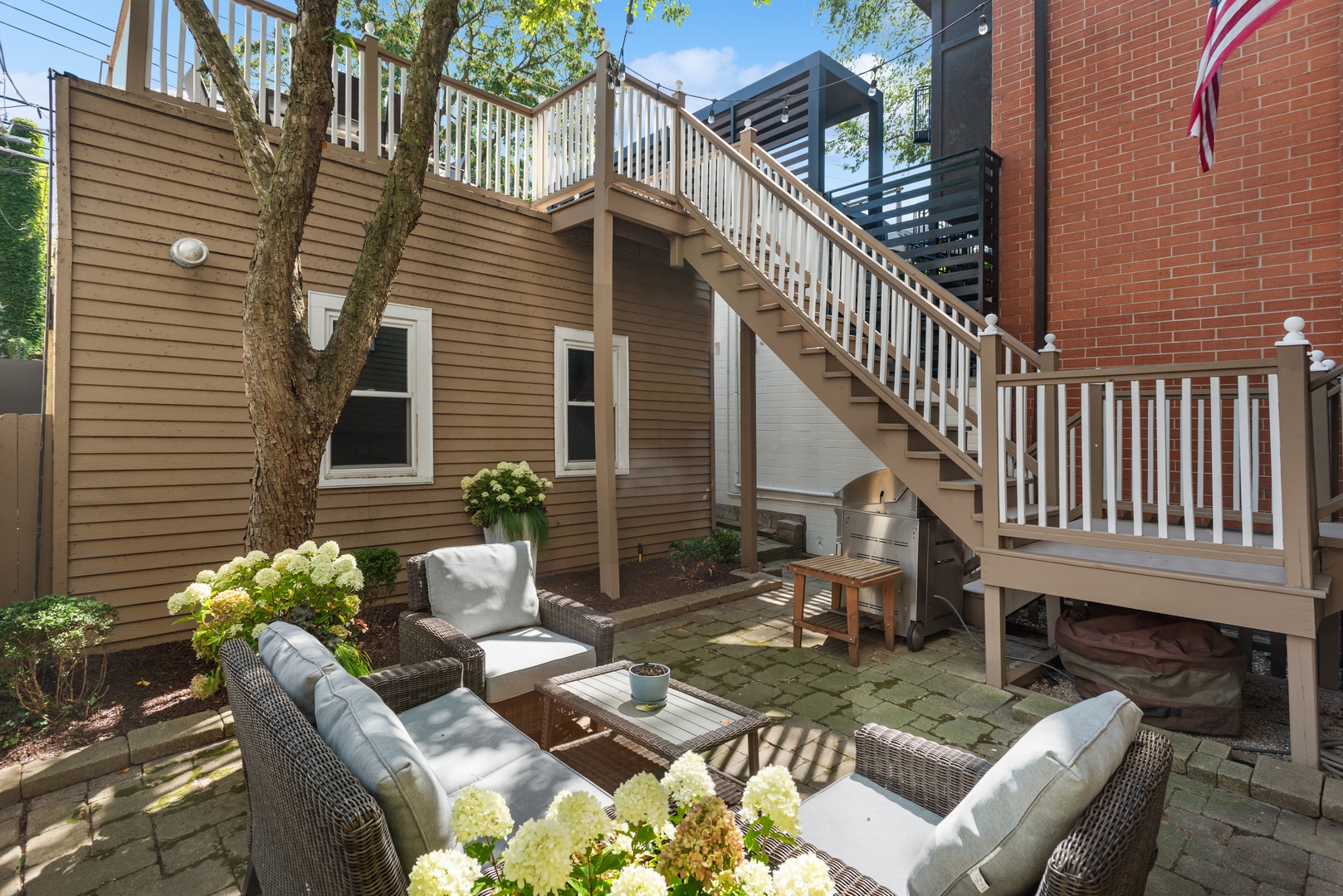 2511 North Burling Street Chicago, IL 60614 - Photo 31 of 37 a view of a house with backyard and sitting area