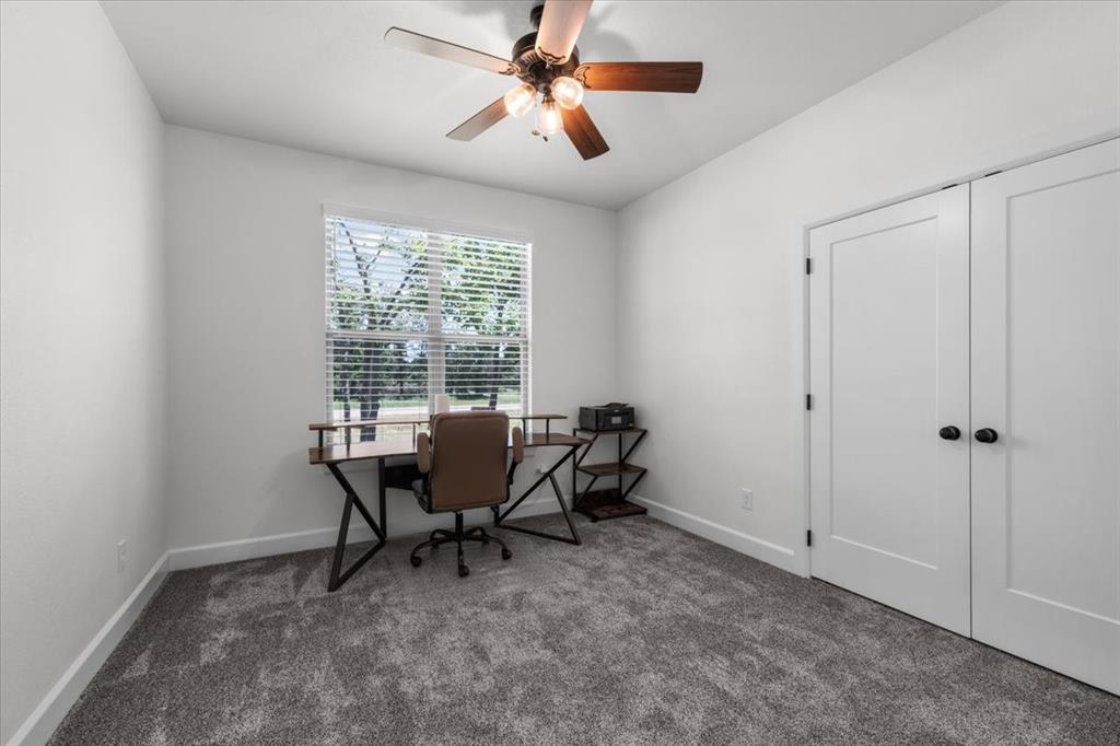 1039 Monaco Court Springtown, TX 76082 - Photo 21 of 33 Bedroom featuring like new carpet and fan