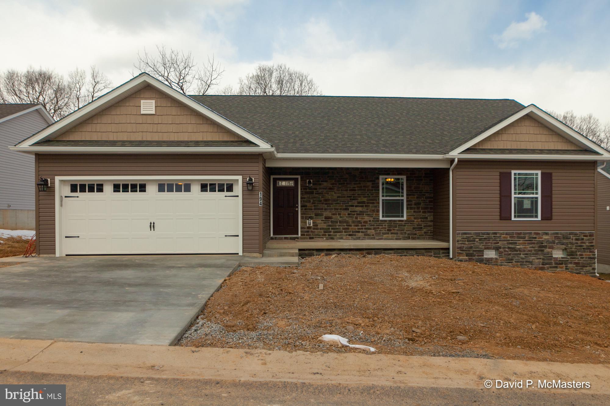 194 Dimension Road Inwood, WV 25428 - Photo 2 of 26 front view of a house with a yard