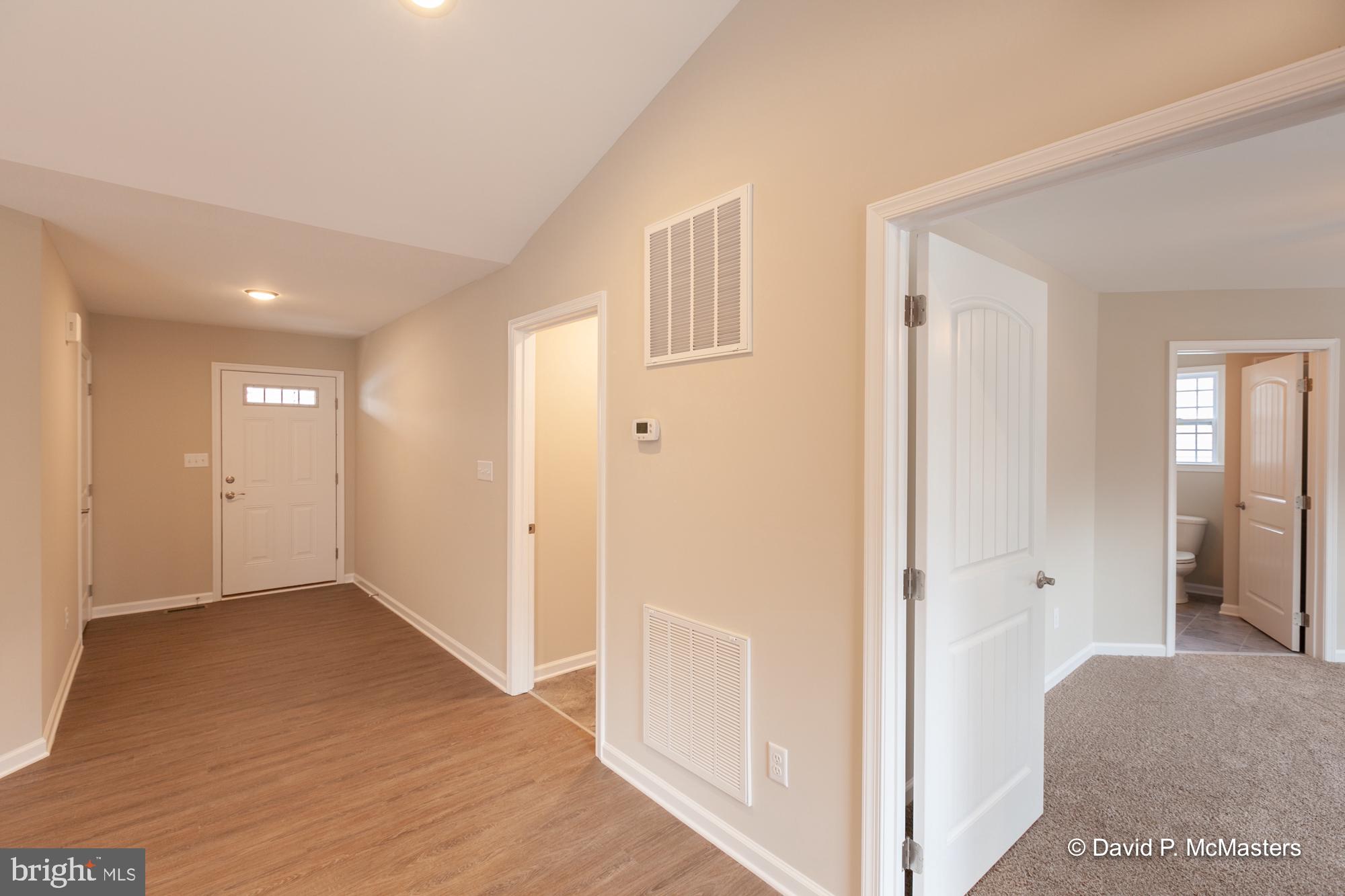194 Dimension Road Inwood, WV 25428 - Photo 24 of 26 a view of a hallway with wooden floor and closet area