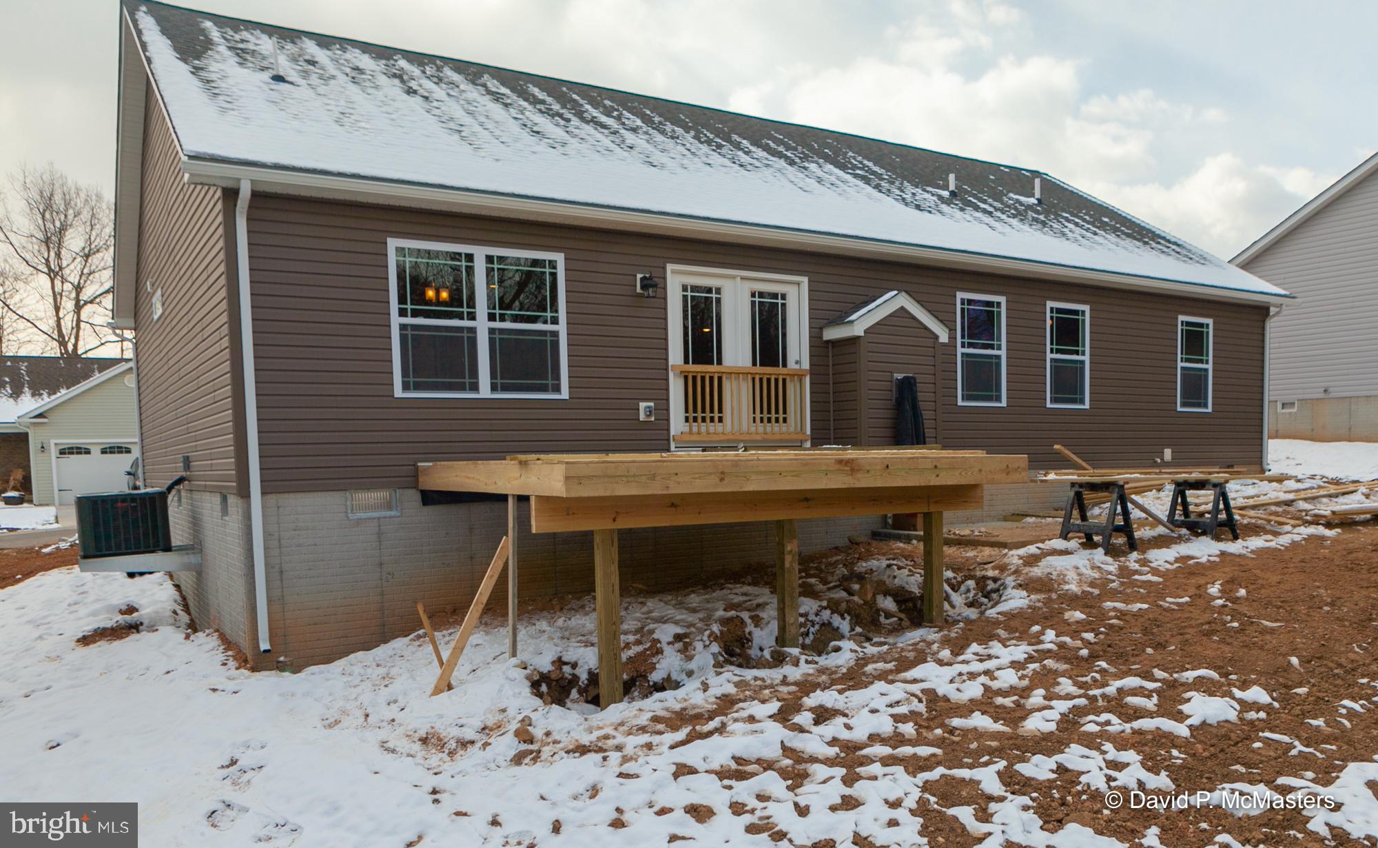 194 Dimension Road Inwood, WV 25428 - Photo 26 of 26 a backyard of a house with table and chairs