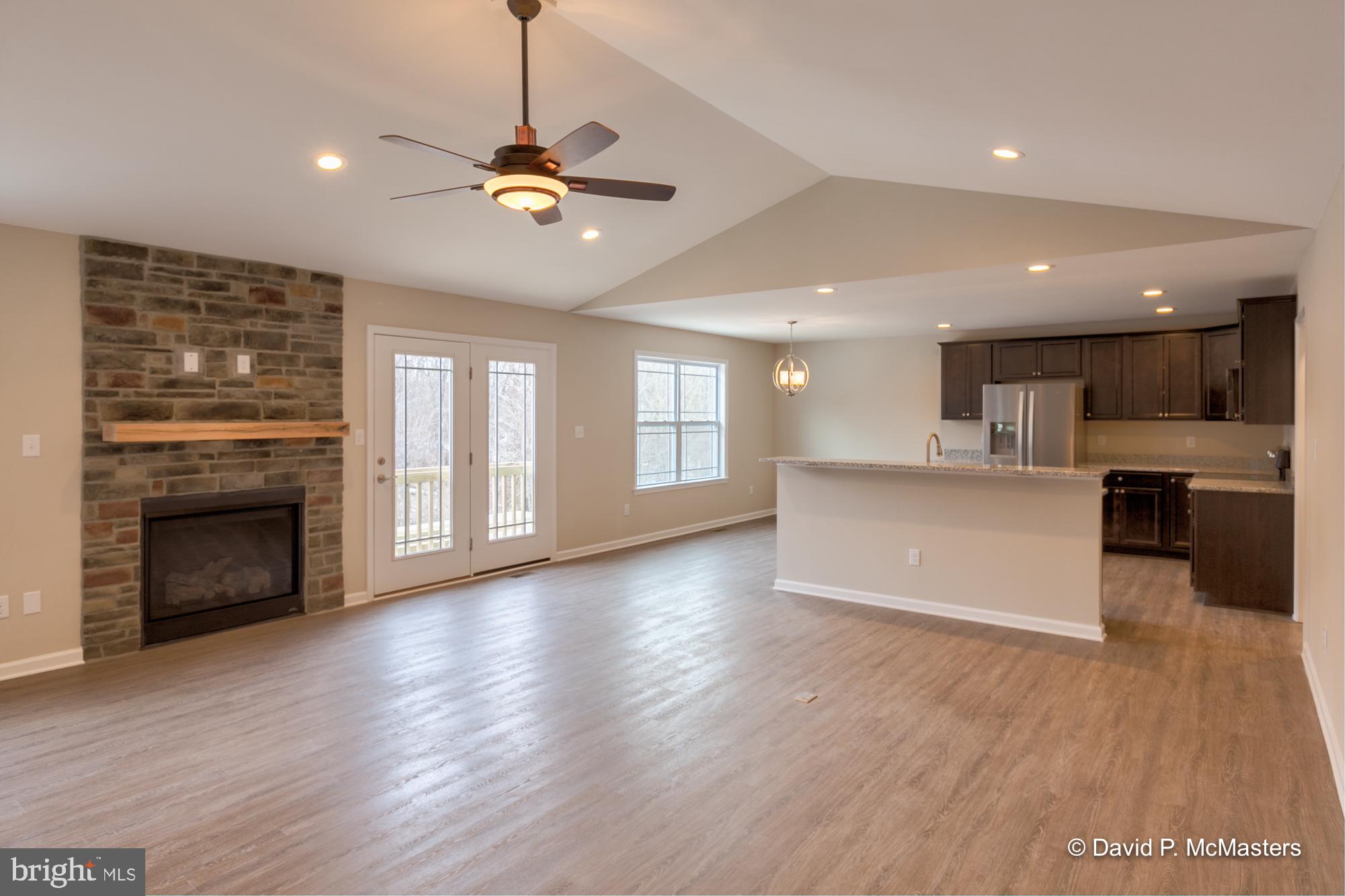 194 Dimension Road Inwood, WV 25428 - Photo 4 of 26 a view of a kitchen with a stove cabinets and wooden floor