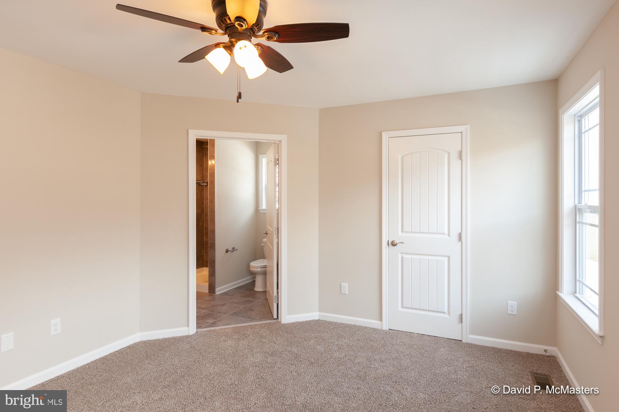 194 Dimension Road Inwood, WV 25428 - Photo 5 of 26 a view of a room with a ceiling fan and a window