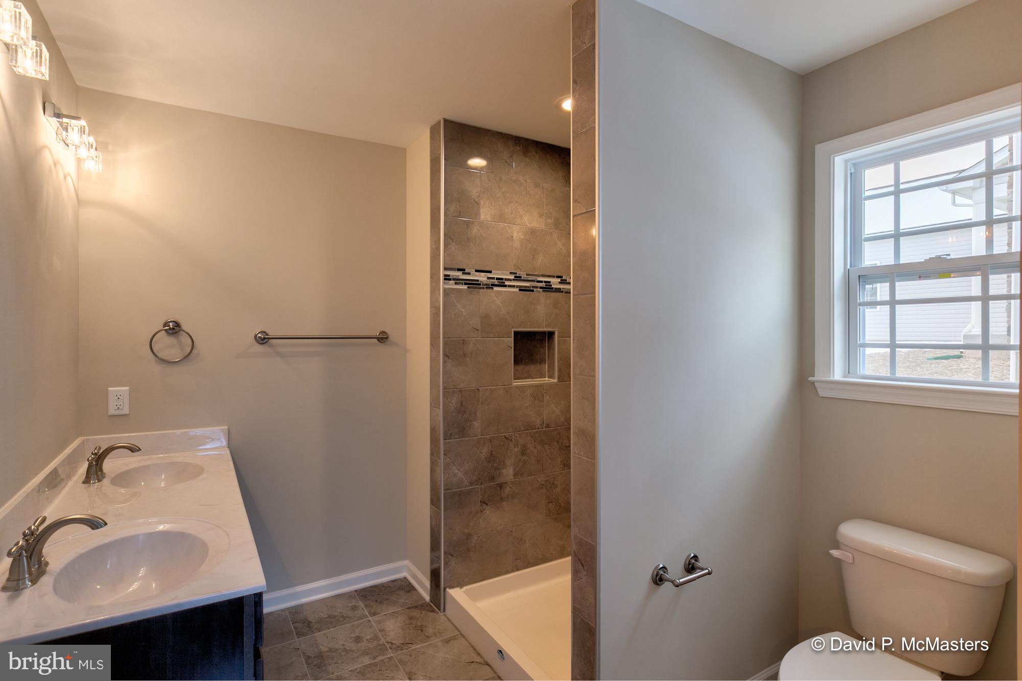 194 Dimension Road Inwood, WV 25428 - Photo 6 of 26 a bathroom with a sink and mirror