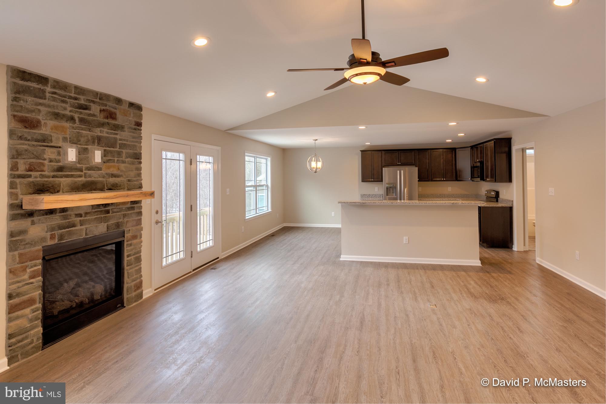 194 Dimension Road Inwood, WV 25428 - Photo 8 of 26 a view of a kitchen with a stove cabinets and wooden floor