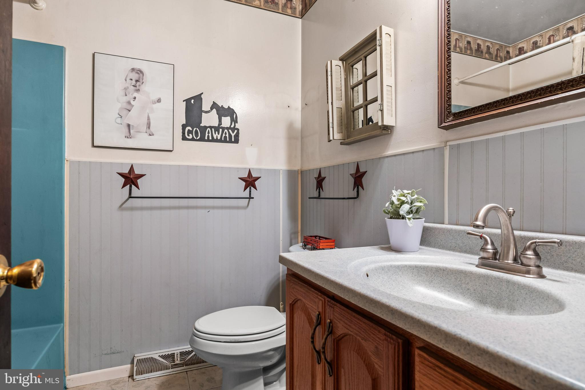 25 Panama Road Chatsworth, NJ 08019 - Photo 23 of 50 a bathroom with a granite countertop sink and a toilet