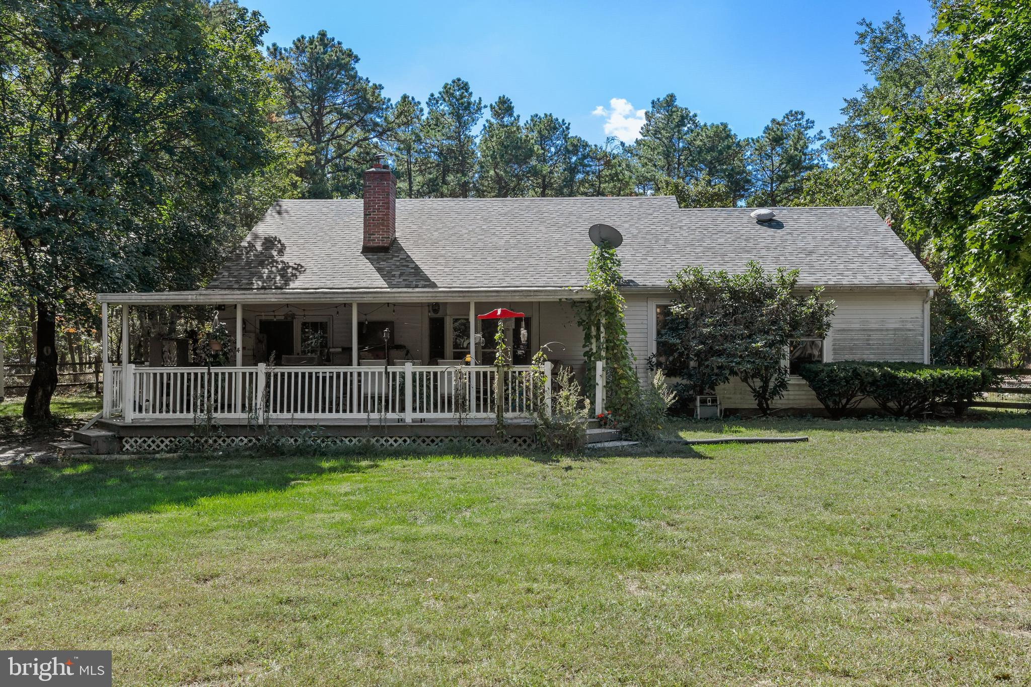 25 Panama Road Chatsworth, NJ 08019 - Photo 24 of 50 a view of a house with a yard and a garden