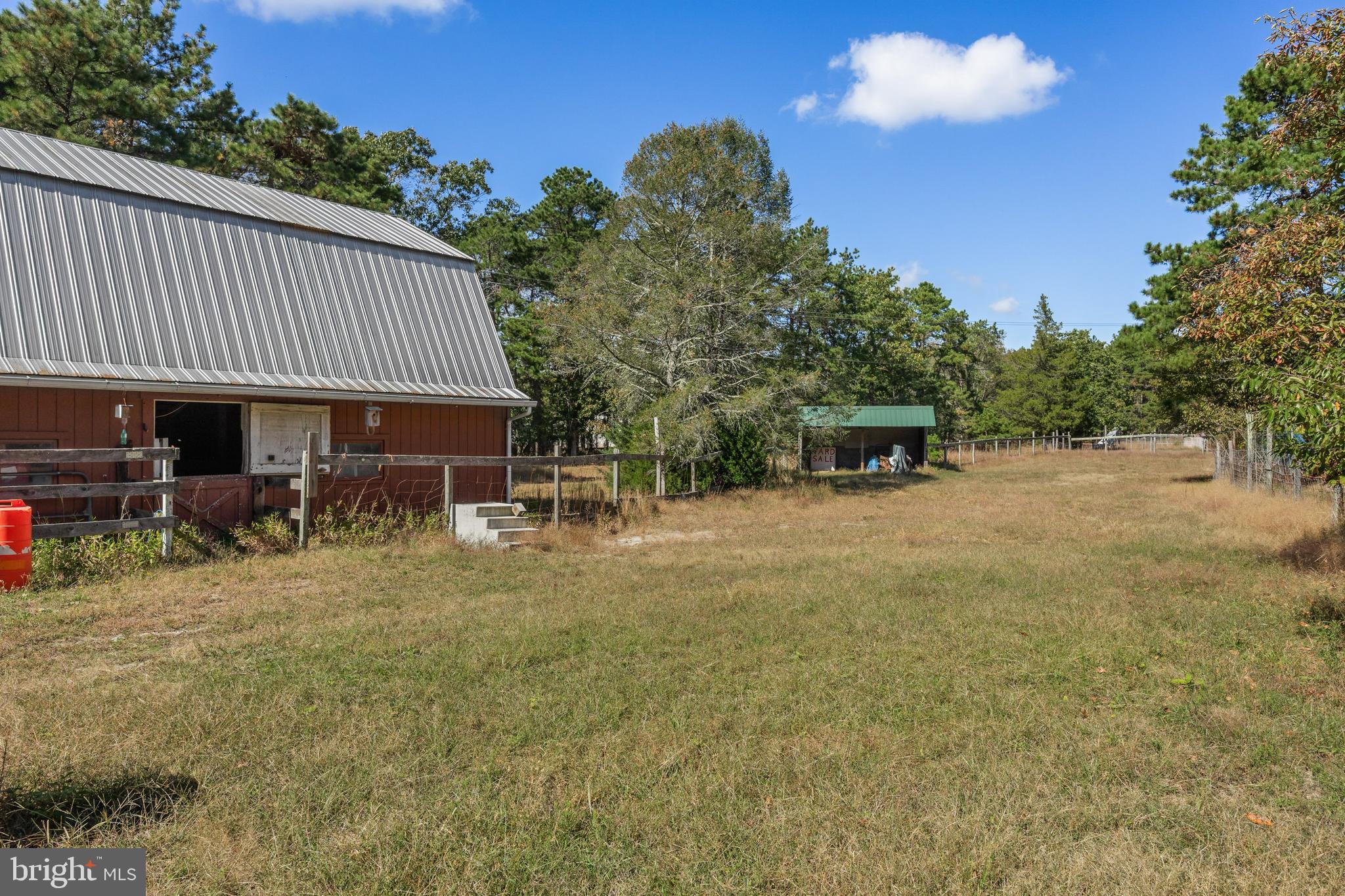25 Panama Road Chatsworth, NJ 08019 - Photo 35 of 50 a backyard of a house with table and chairs