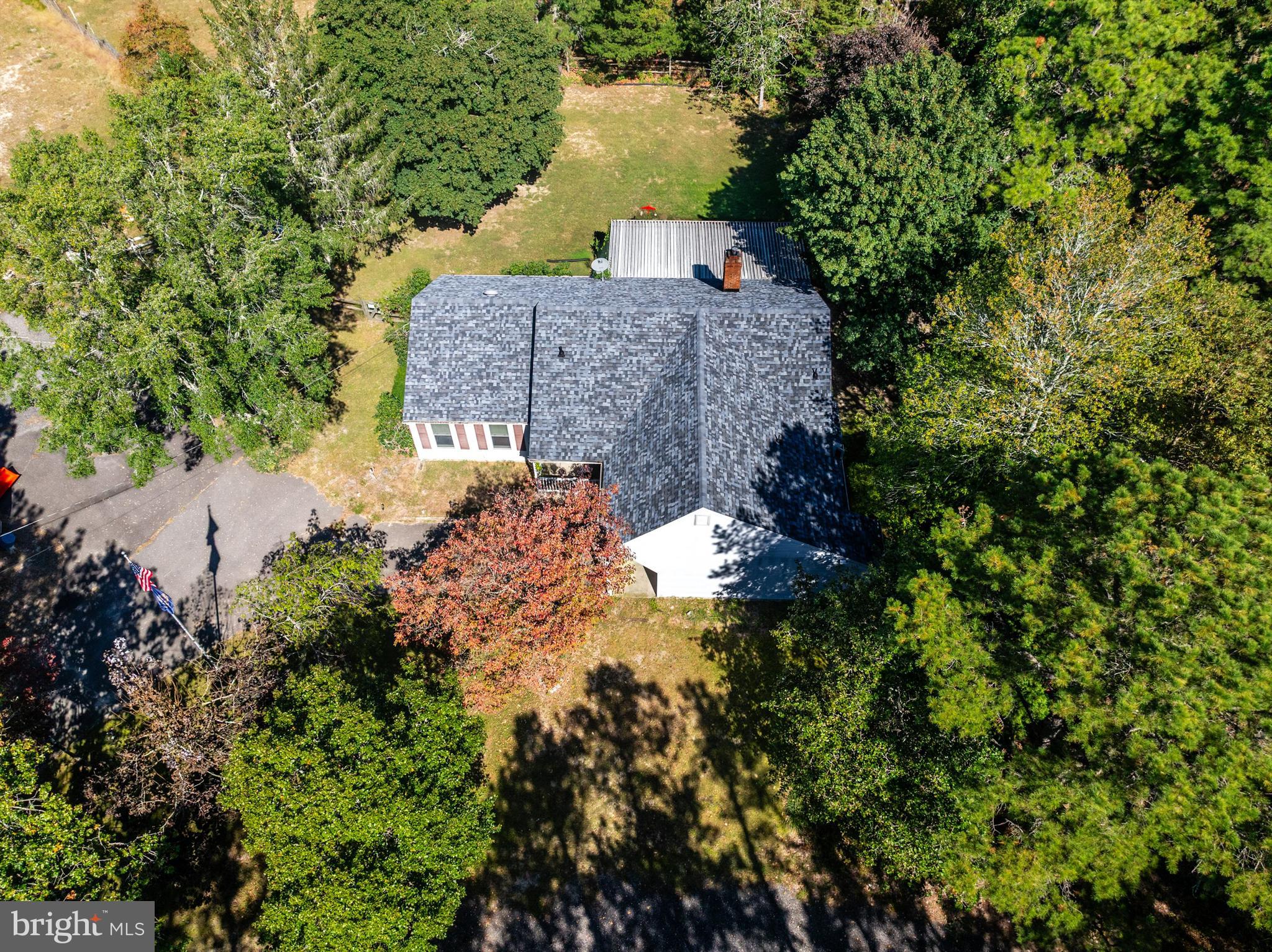 25 Panama Road Chatsworth, NJ 08019 - Photo 39 of 50 an aerial view of a house with a yard and garden