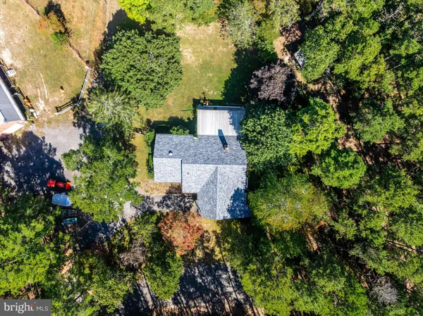 an aerial view of a house with a garden