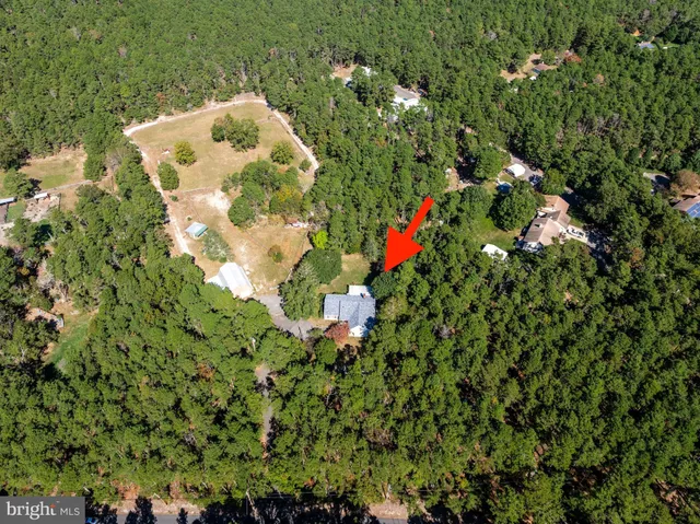 a picture of a house with a tree