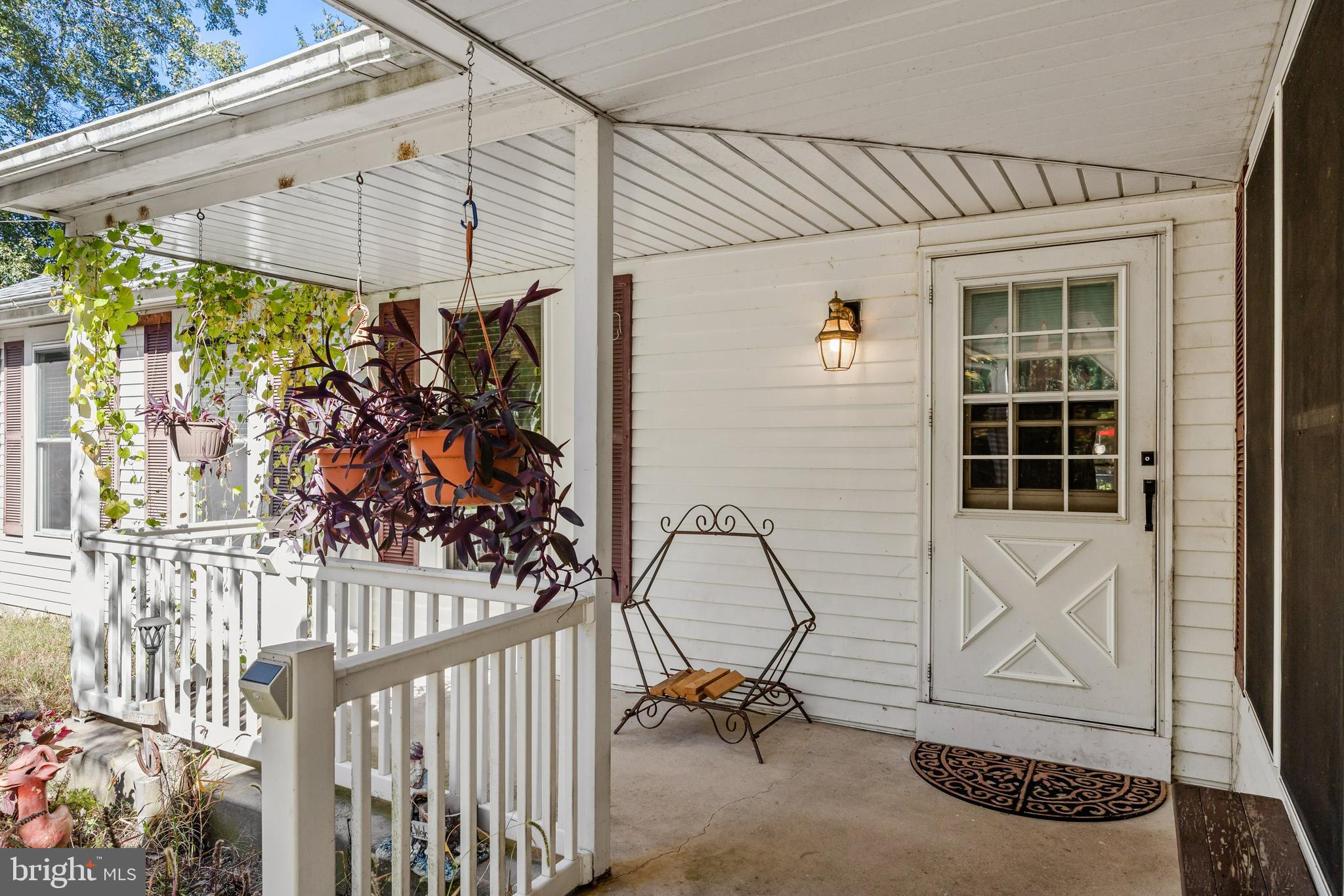 25 Panama Road Chatsworth, NJ 08019 - Photo 7 of 50 a view of a porch with a table and chairs