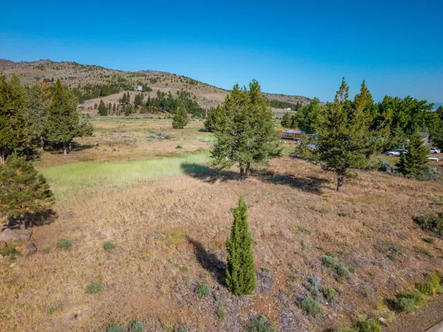 a view of a road with a mountain in the background