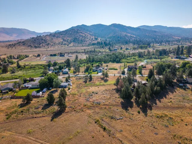 a view of a town with mountains in the background