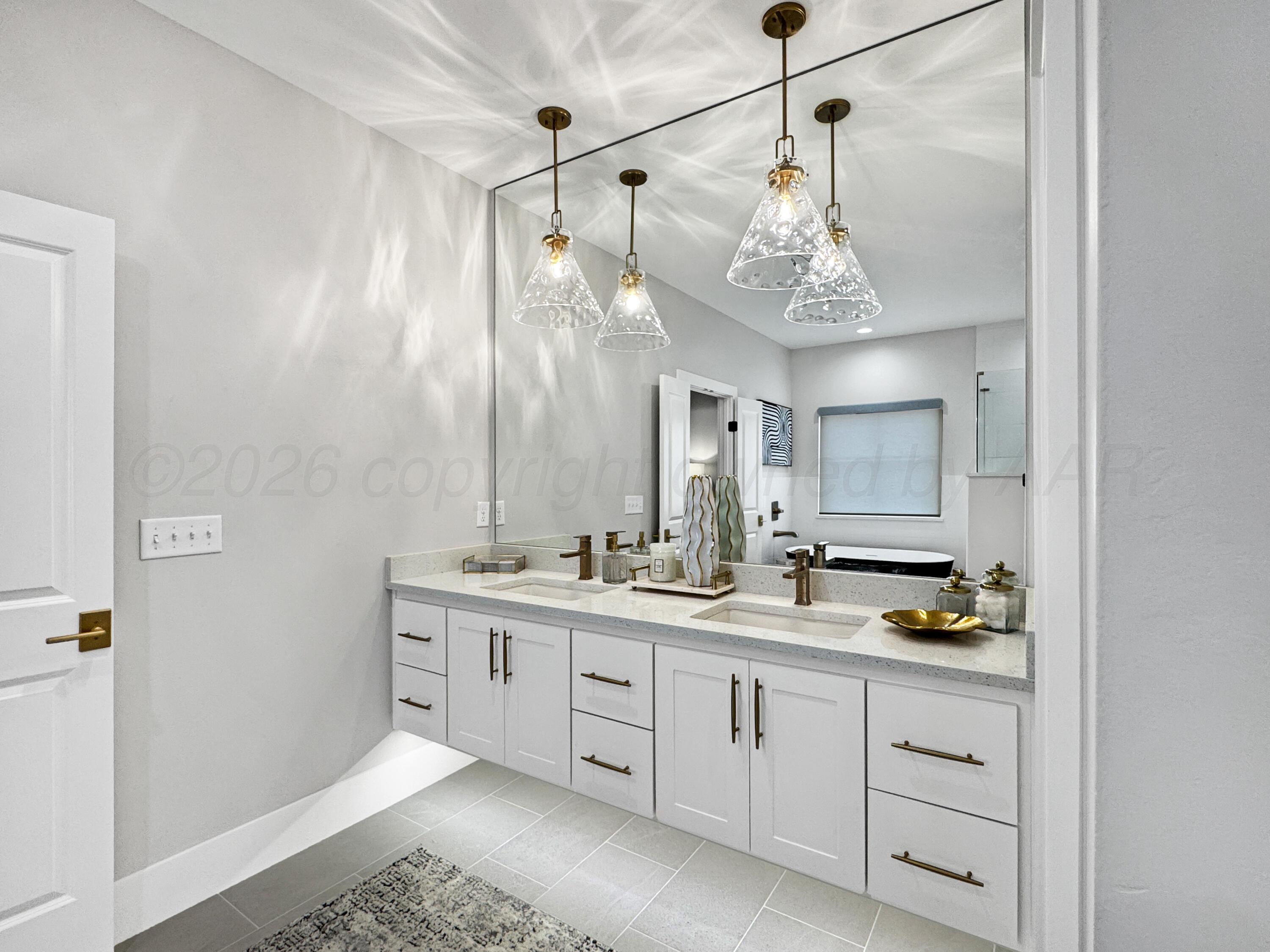 3701 Longhorn Springs Road Amarillo, TX 79119 - Photo 21 of 48 a bathroom with a double vanity sink mirror and