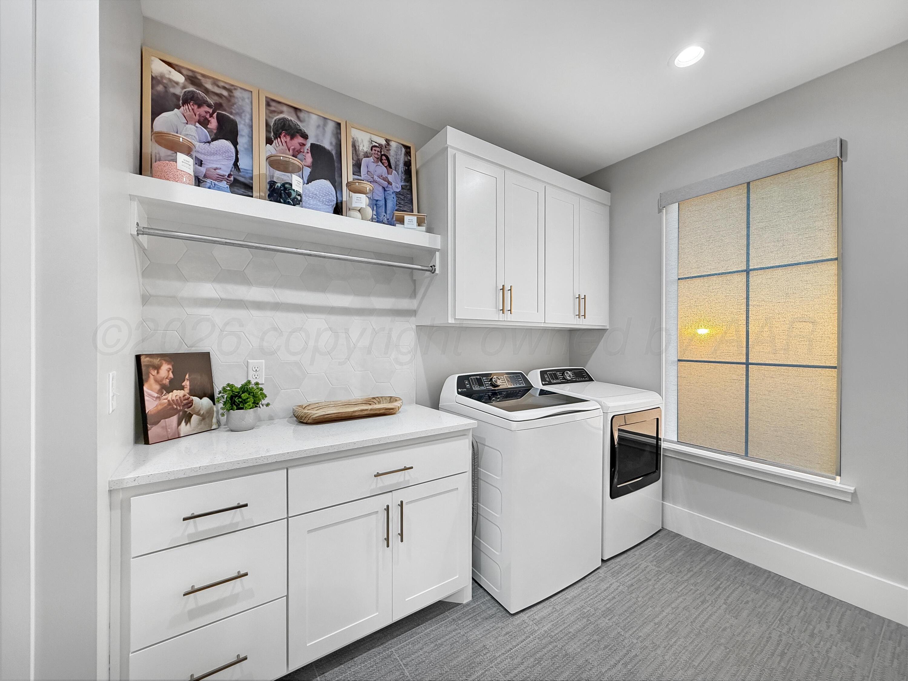 3701 Longhorn Springs Road Amarillo, TX 79119 - Photo 27 of 48 a kitchen with a stove and cabinets