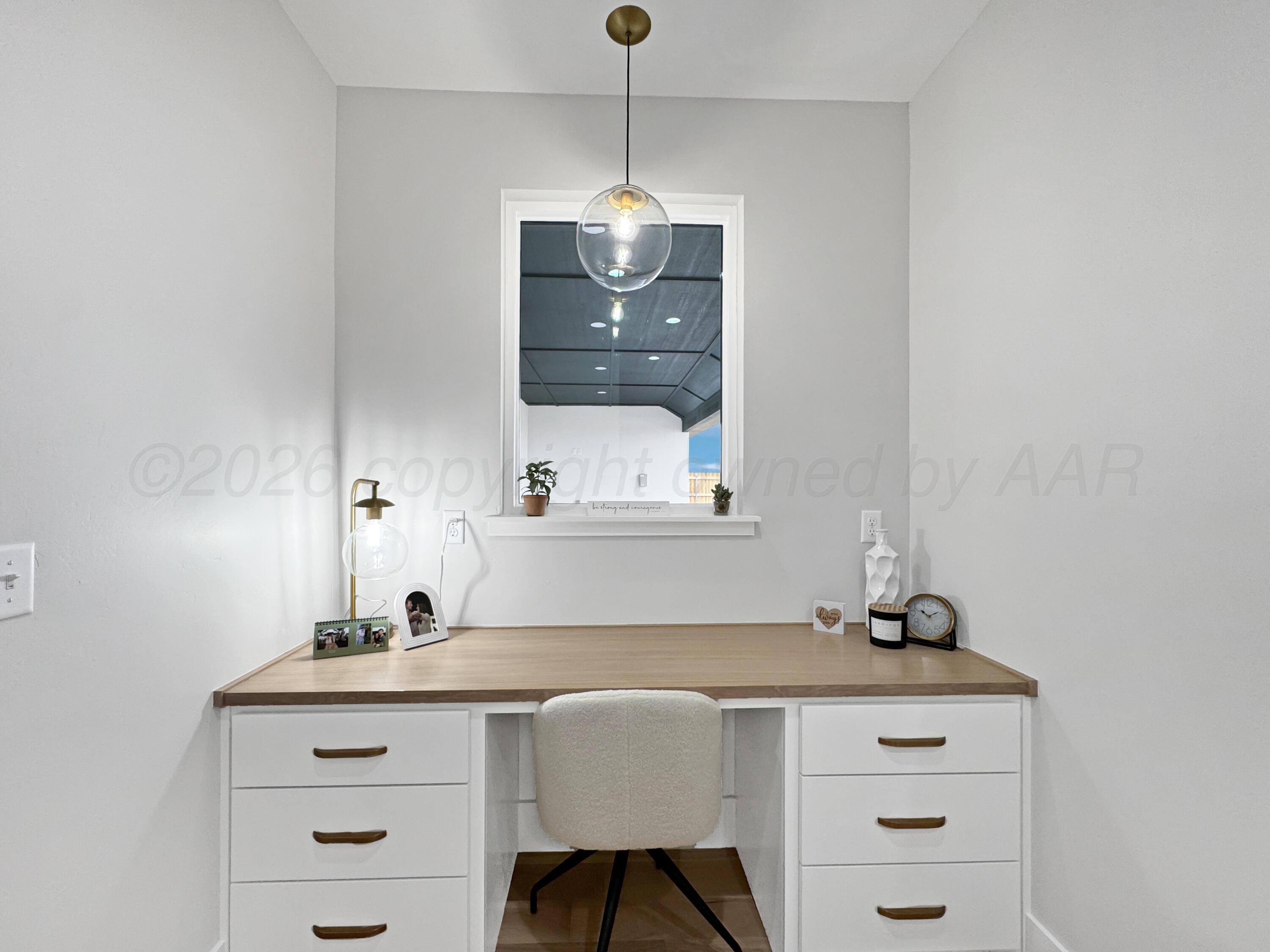 3701 Longhorn Springs Road Amarillo, TX 79119 - Photo 31 of 48 a room with a sink cabinets and window