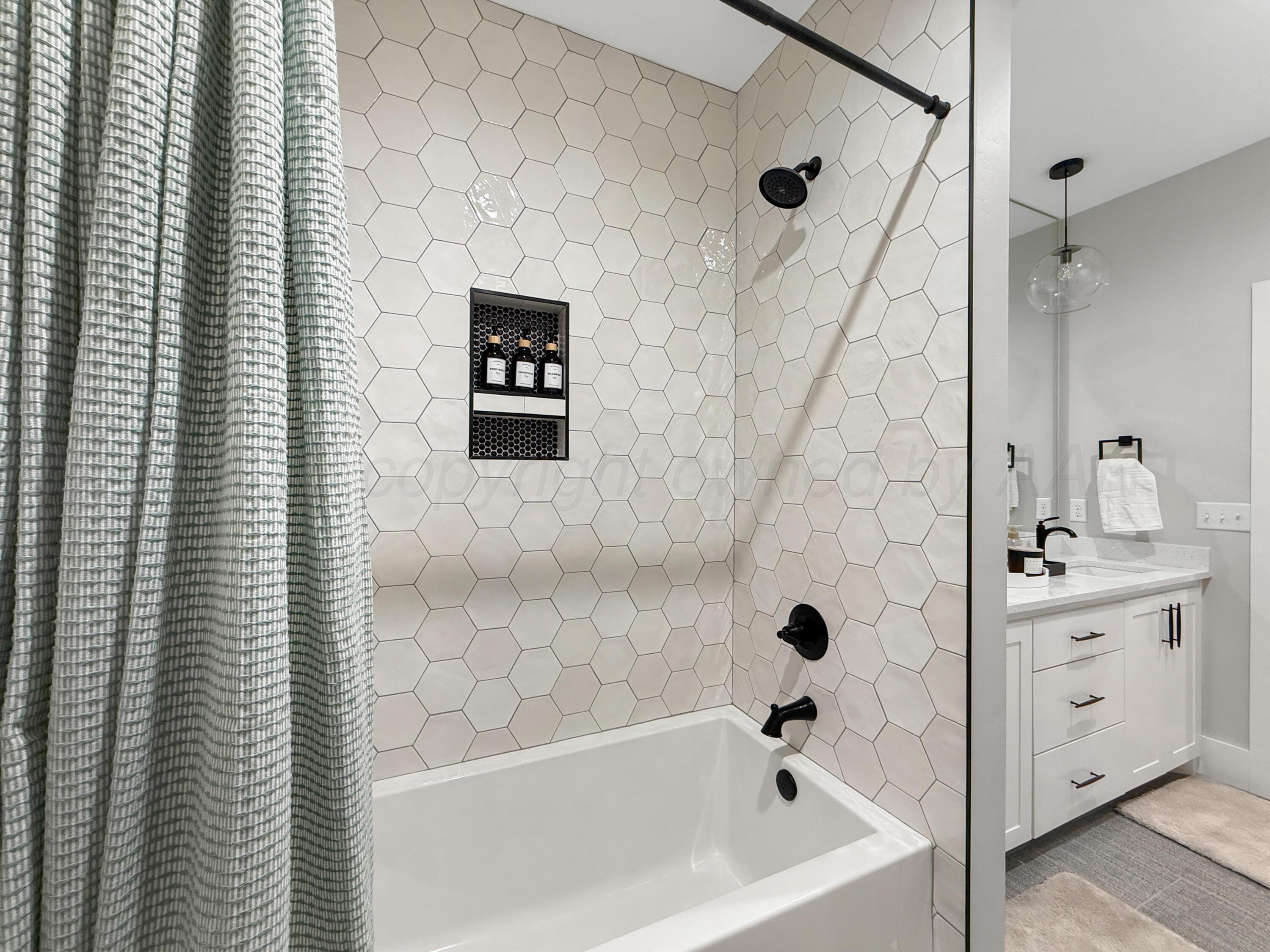 3701 Longhorn Springs Road Amarillo, TX 79119 - Photo 37 of 48 a bathroom with a bathtub and shower