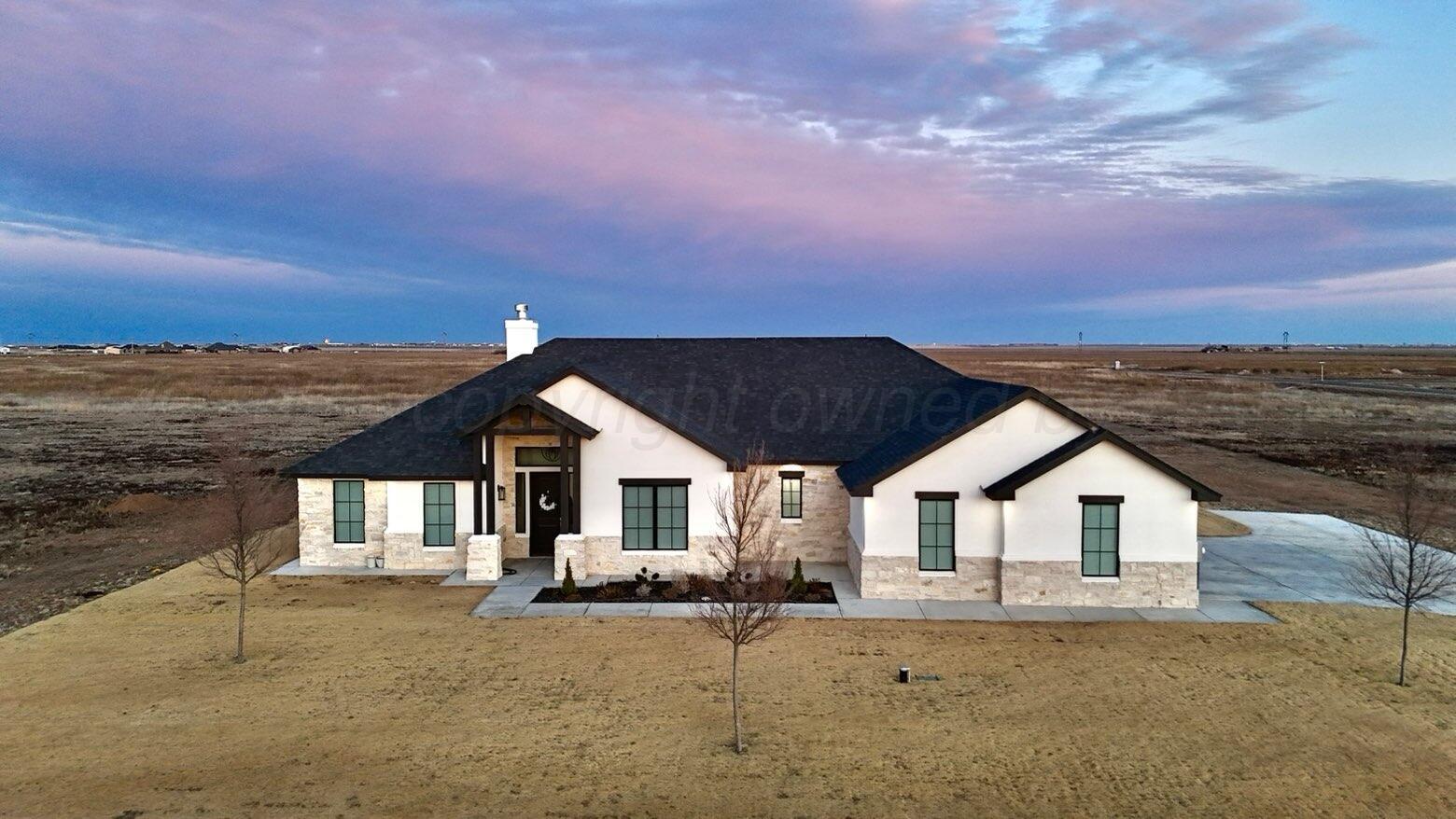3701 Longhorn Springs Road Amarillo, TX 79119 - Photo 4 of 48 a front view of a house with a yard