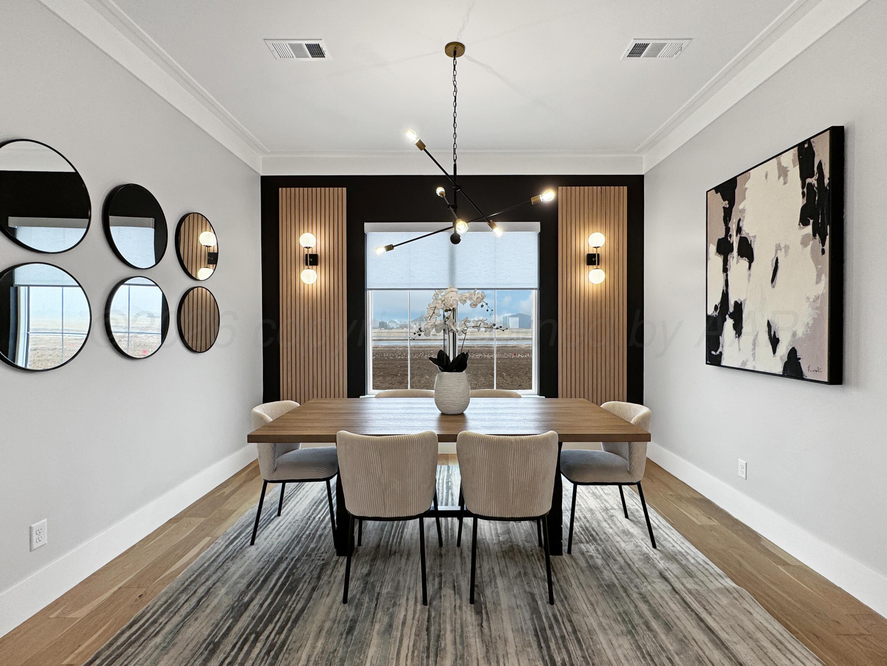 3701 Longhorn Springs Road Amarillo, TX 79119 - Photo 10 of 48 a view of a dining room with furniture window and wooden floor