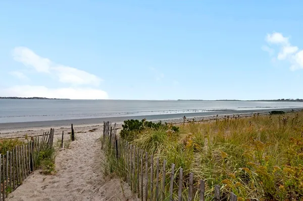 a view of a swimming pool and an outdoor seating