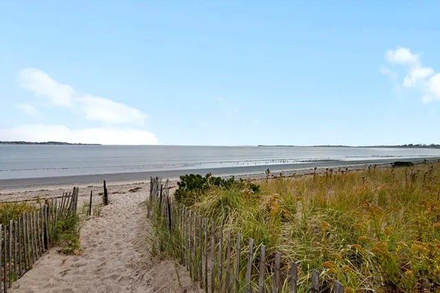 a view of a swimming pool and an outdoor seating