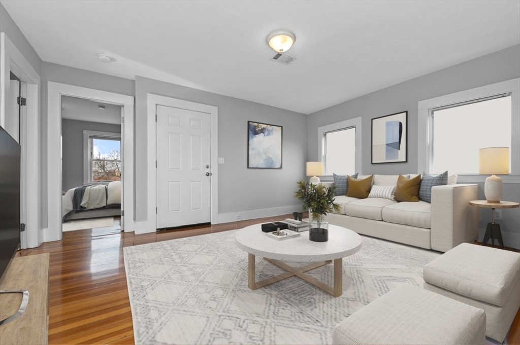 129 Lynnway, Unit 3 Revere, MA 02151 - Photo 2 of 14 a living room with furniture a rug and a window