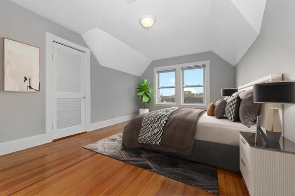 a bedroom with a bed and window